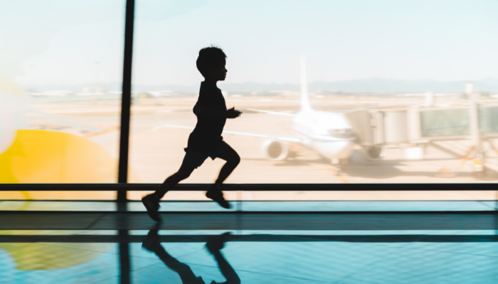 child running around in airport