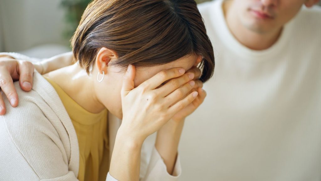 Partner consoling his wife